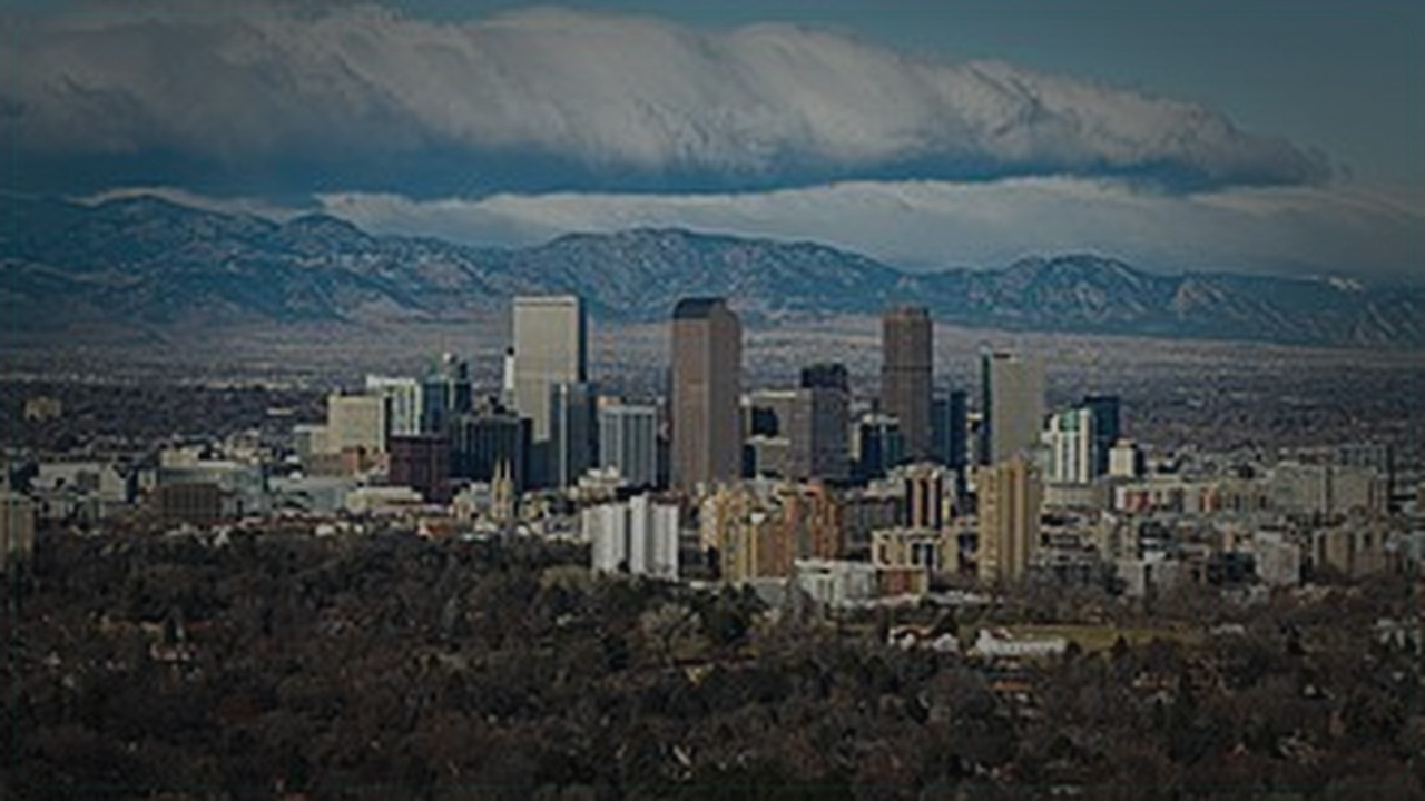 Denver skyline themed Pine Script service cover with dark market grading