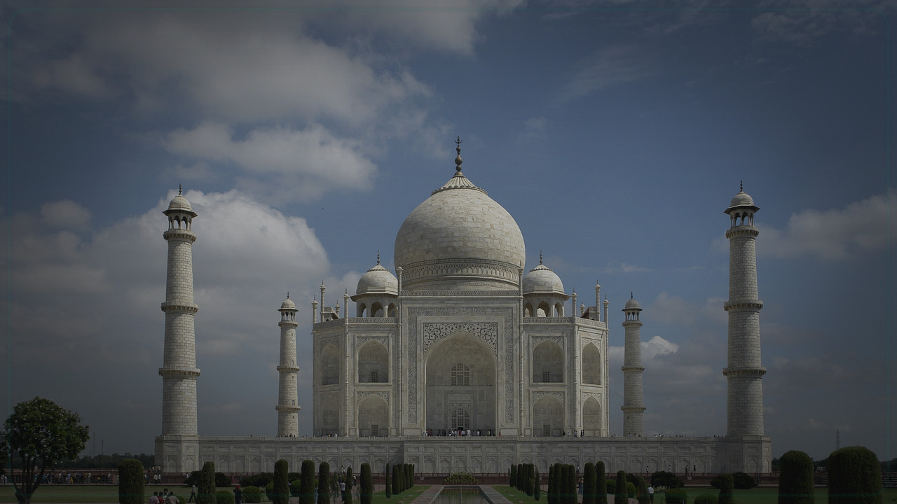 Agra India skyline themed Pine Script service cover with dark market grading