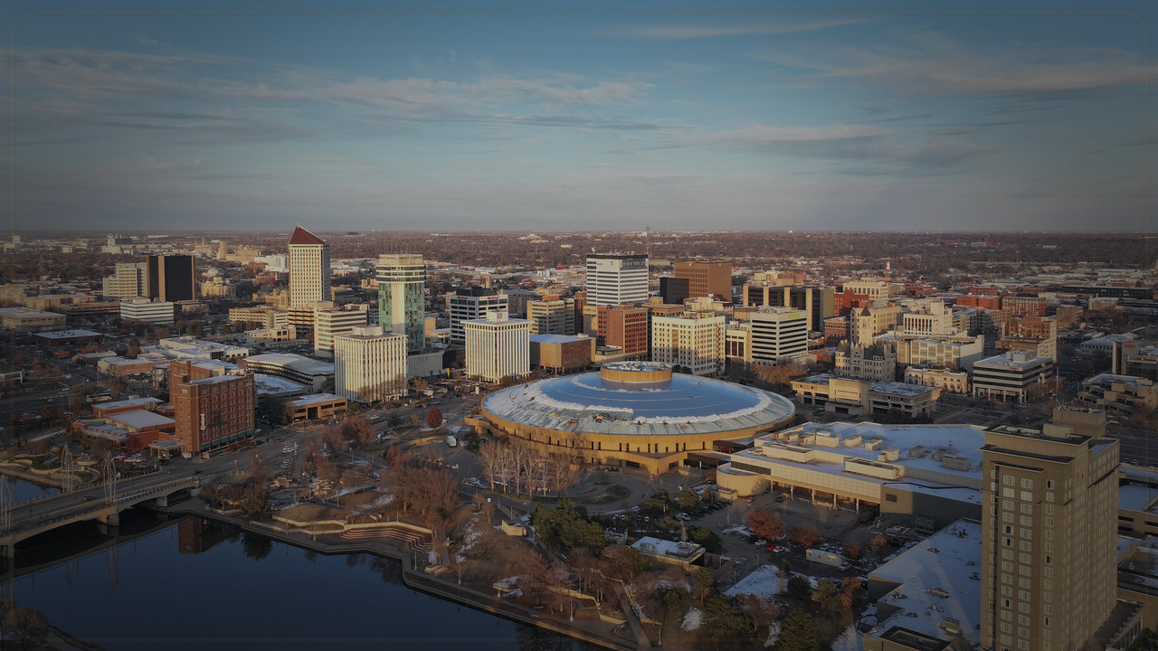 Wichita skyline themed Pine Script service cover with dark market grading